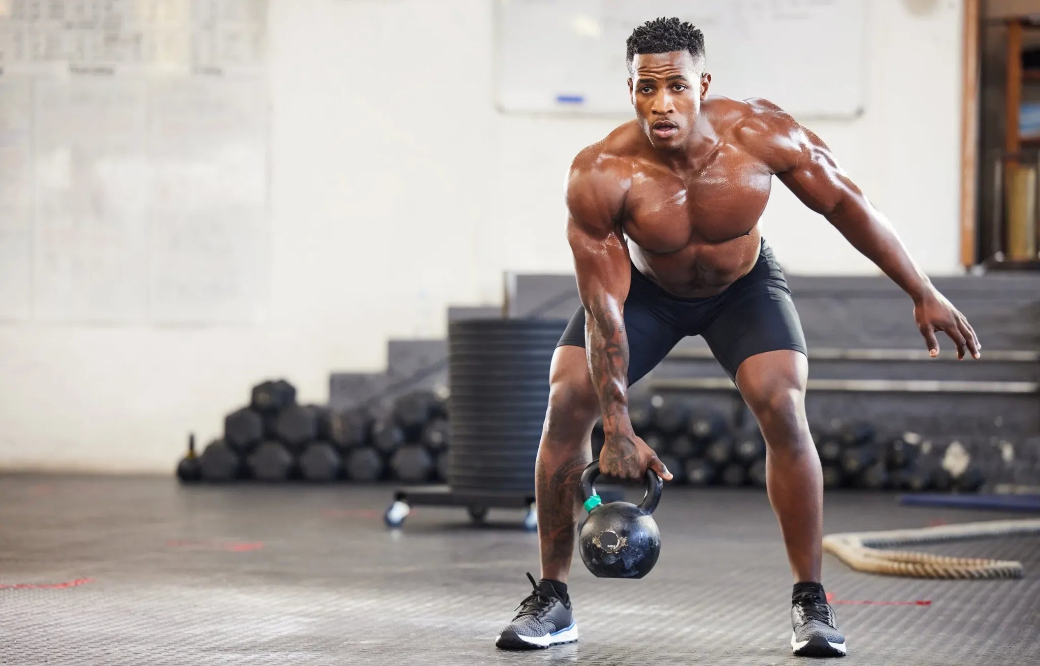 Man strength training with a kettlebell
